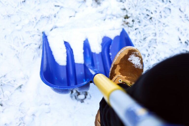 man-worker-uniform-shoveling-snow-close-up-image